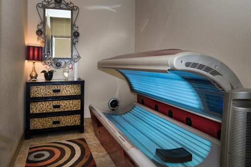 a small room with a tanning bed