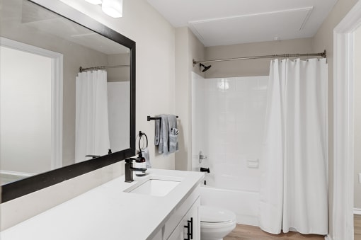 Renovated bathroom with White Cabinets