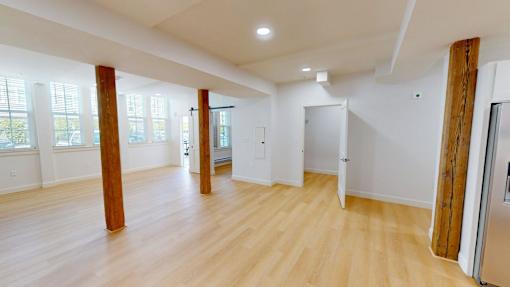 A room with wooden floors and white walls.
