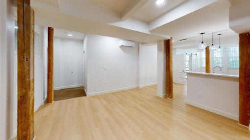 A room with wooden floors and white walls.