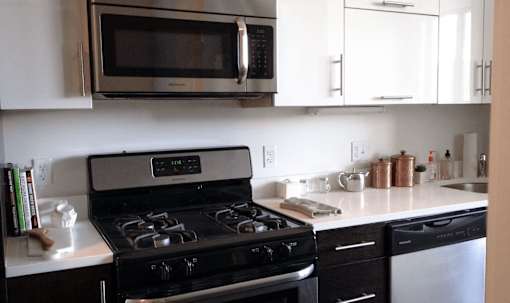 A black stove top oven with a digital display in the middle.