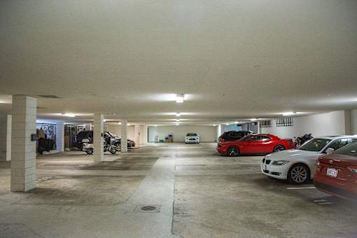 A parking garage with cars parked in it.
