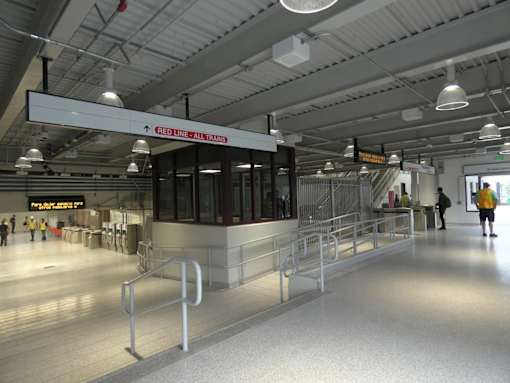Red line station interior with accessibility ramp at 68 Beale Apartments, Massachusetts