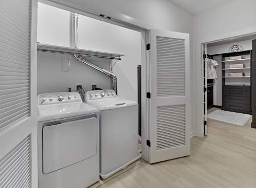 A laundry room with a washer and dryer.