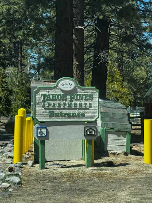 A sign for the Tahoe Basin says "Welcome" and has a handicap symbol on it.