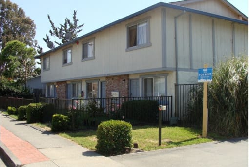 a house with a street sign in front of it