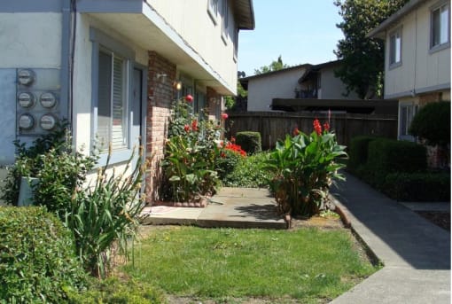 a small garden in front of a house
