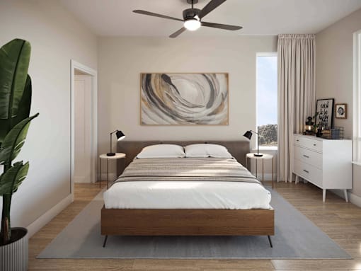 A modern bedroom with a large bed and a painting on the wall.