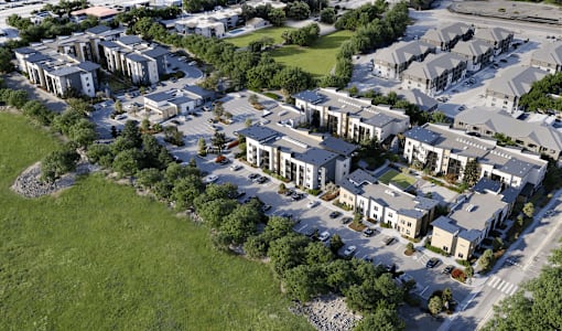 A bird's eye view of a residential area with multiple houses.