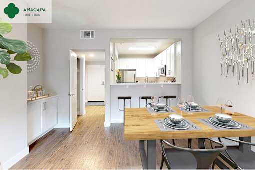A dining room with a wooden table set for two at Mission Hills, Camarillo, 93012