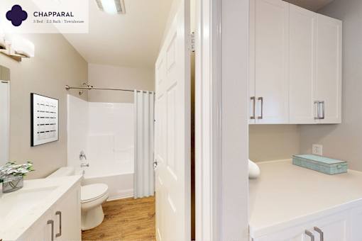 A white bathroom with a toilet, sink, and shower at Mission Hills, Camarillo, 93012
