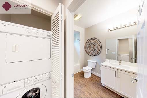 A white washing machine is in a small laundry room at Mission Hills, Camarillo, 93012