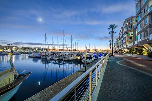 A marina with boats docked and a building on the right at Esprit Marina del Rey, 90292