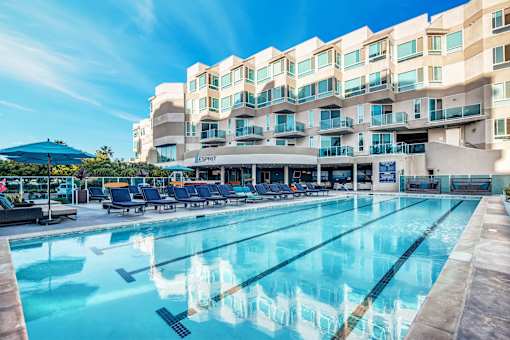 A large swimming pool in front of a multi-story hotel at Esprit Marina del Rey, 90292
