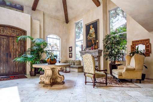 a living room filled with furniture and a table