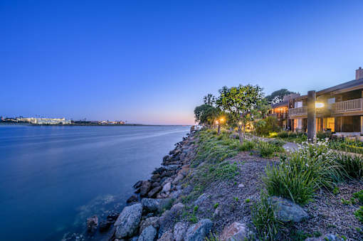 a home on the water overlooking the water at night at Mariners Village, Marina del Rey, California