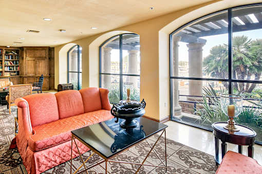 A living room with a red sofa and a glass coffee table at Marina Harbor, California, 90292