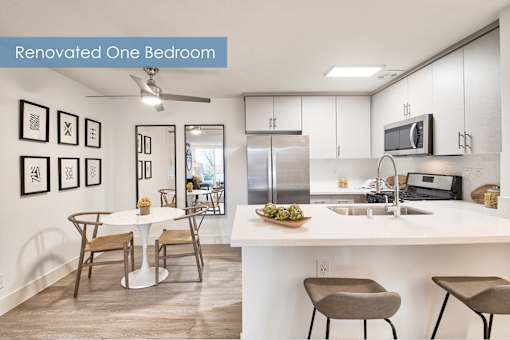A renovated one bedroom apartment with a kitchen and dining area at The Meadows Apartments, Culver City , CA 90230