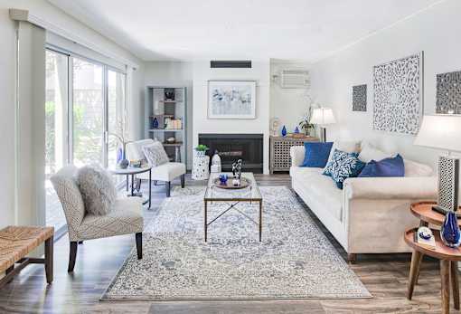 A living room with a fireplace and a couch.