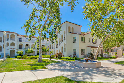 A sunny day at a courtyard with a fountain and trees at Mission Hills, Camarillo, 93012