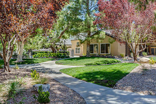 A house with a garden in front of it.