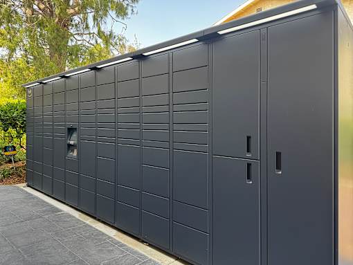 A long black storage unit with a door and a window at Village Pointe Apartments, Northridge, California