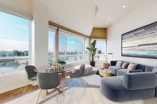 A modern living room with a view of a marina at Esprit Marina del Rey, 90292