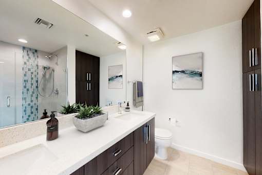 A bathroom with a white counter top and a toilet in the corner at Esprit Marina del Rey, 90292