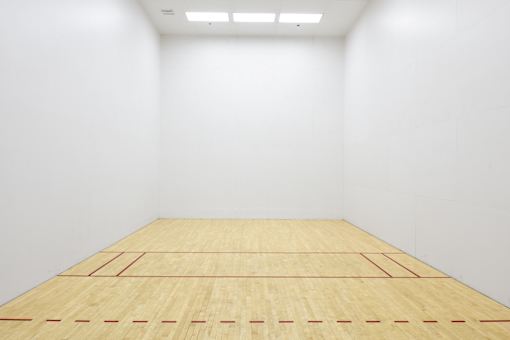 A squash court with a wooden floor and white walls at Esprit Marina del Rey, 90292