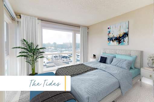A bedroom with a large bed and a view of the beach at Marina Harbor, California, 90292