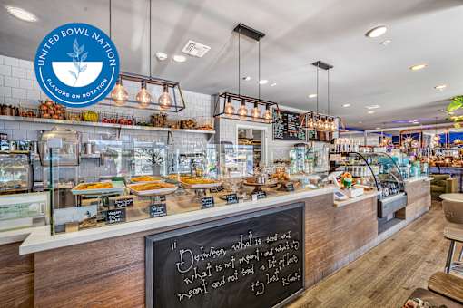 A bakery interior with a chalkboard sign that says at Esprit Marina del Rey, 90292