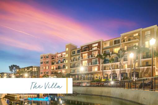 The image shows a building named The Villa with a beautiful view of the waterfront at dusk at Marina Harbor, California, 90292