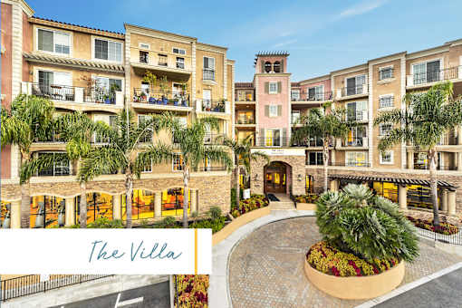 A large building with a courtyard and palm trees is called The Villa at Marina Harbor, California, 90292