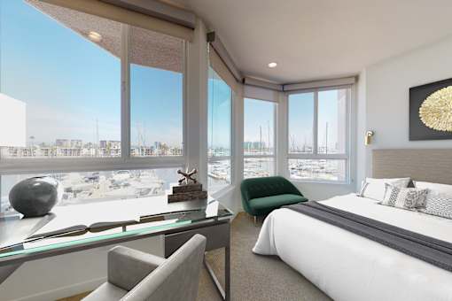 A bedroom with a large bed and a view of the city at Esprit Marina del Rey, 90292
