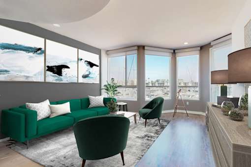 A living room with a green couch and a blue rug at Esprit Marina del Rey, 90292