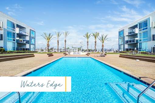 A large swimming pool in front of a building with the name Waters Edge at Marina Harbor, California, 90292