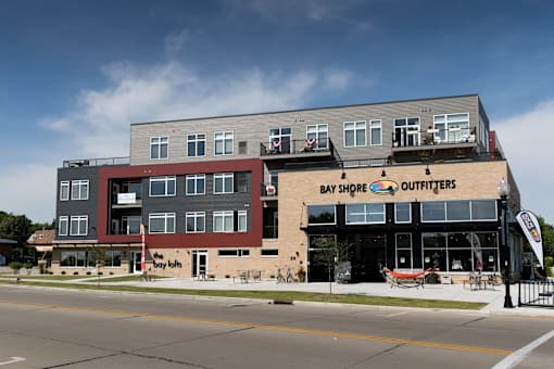 A building with a Bay Shore Outfitters storefront.