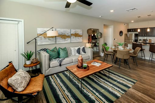 a living room with a couch and a table at Level 25 at The Curve by Picerne, Nevada 89148