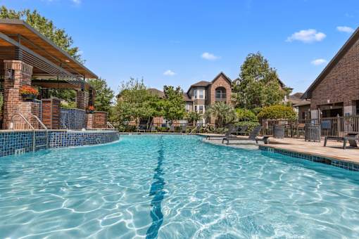 Large resort-style swimming pool at Asheville at Spring Branch apartments in Houston, TX