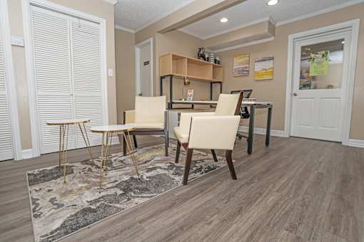 A leasing office with a rug and chairs  at The Creole Apartments in Shreveport, LA