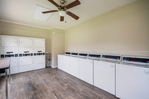 Laundry Room at Bookstone and Terrace Apartments in Irving, Texas