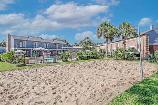 Sand volleyball court beside the pool at Magnolia apartments in Shreveport, LA