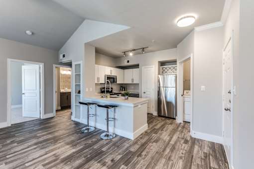 A2 model kitchen and dining area at Asheville at Spring Branch apartments in Houston, TX
