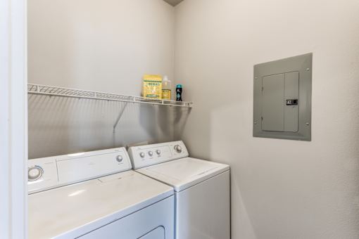 A2 model laundry closet at Asheville at Spring Branch apartments in Houston, TX