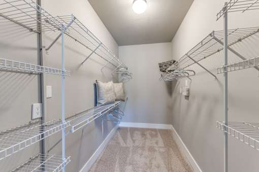 A2 model large walk-in closet at Asheville at Spring Branch apartments in Houston, TX