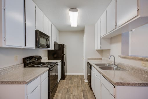Model Kitchen at Bookstone and Terrace Apartments in Irving, Texas