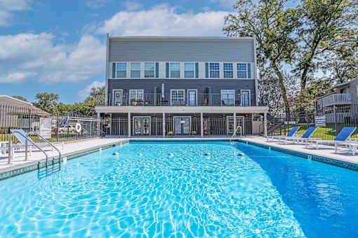Large swimming pool behind the leasing office building at Maplewood apartments in Shreveport, LA.