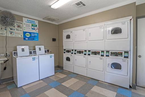 A row of washers and dryers at our onsite laundry facility at The Oasis apartments in Bossier City, LA
