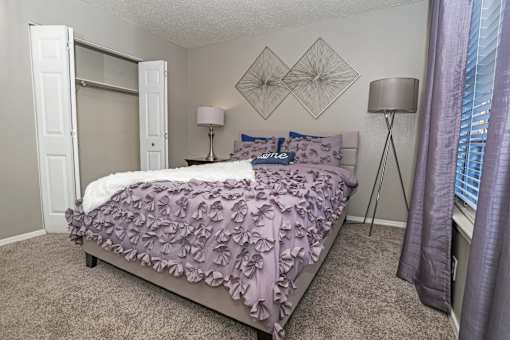 Ambassador bedroom in model home with closet at The Oasis apartments in Bossier City, LA