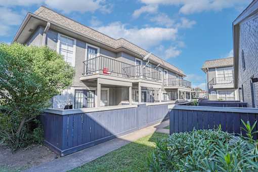 Walkway between apartment patios and balconies at The Oasis apartments in Bossier City, LA